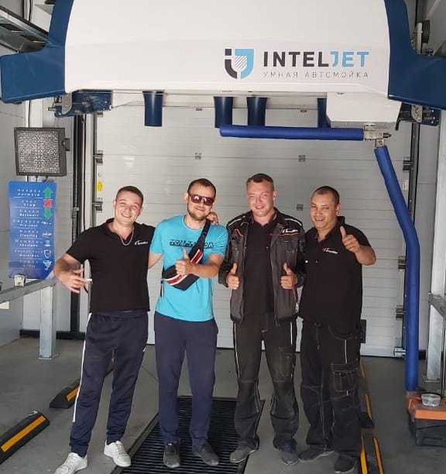 Inteljet technicians with happy customer